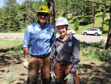 DNR Director Dan Gibbs on a wildfire mitigation project with Mile High Youth Corp members.