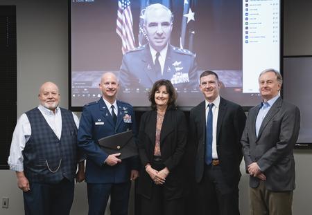 pictured left to right: Chairman of Defense Mission Task Force Keith Klaehn, Colonel & Commander of Schriever Space Force Base David Hanson, Colorado State Board of Land Commissioners President Christine Scanlan, Lt. Governor Chief of Staff Mark Honnen, and Colorado State Board of Land Commissioners Staff Director Bill Ryan (with Lt. General Stephen Whiting appearing virtually)